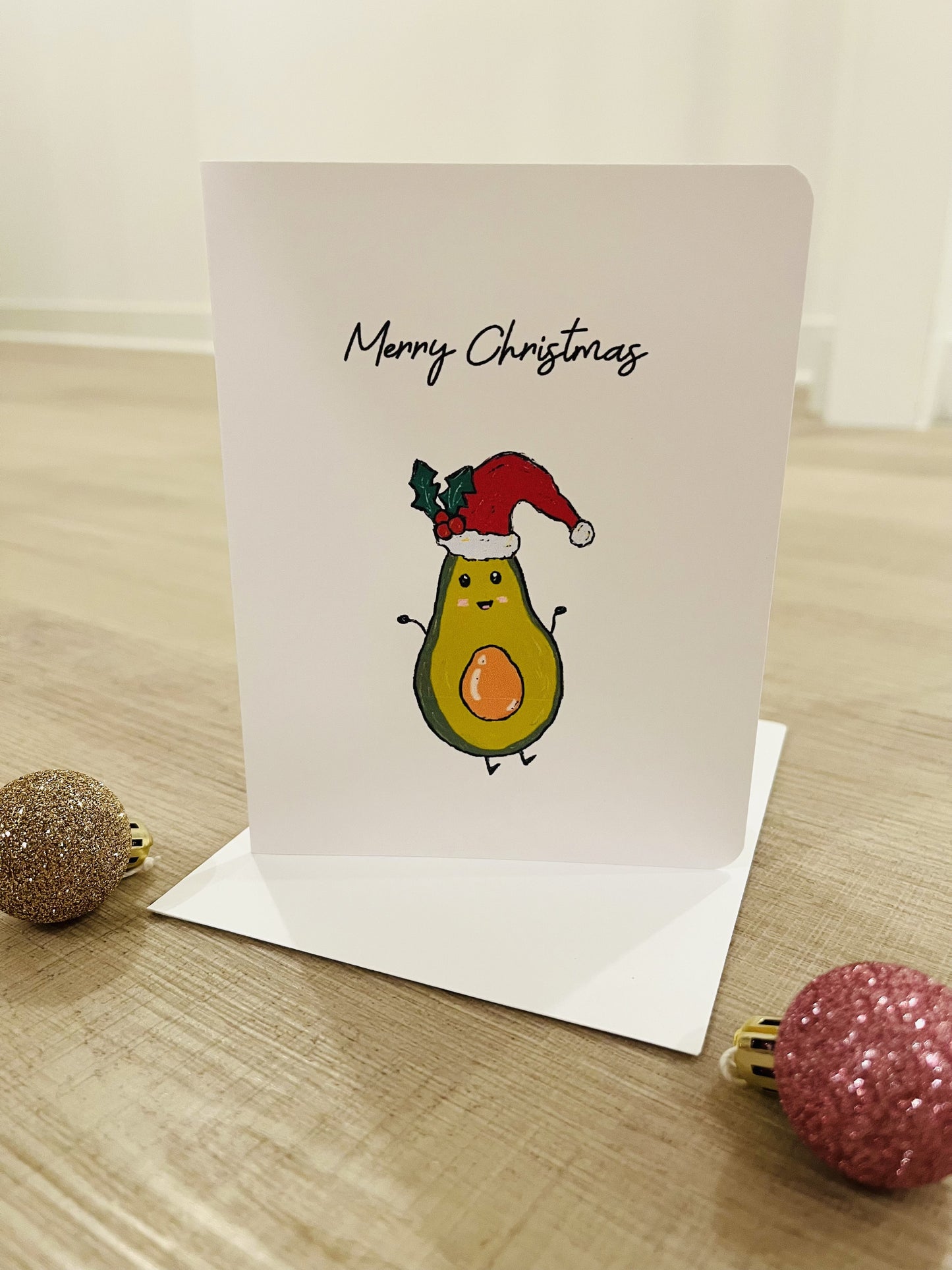 Avocado wearing a Santa hat